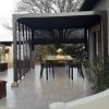 Pergola Bioclimatique Alu Anthracite 10,80m² Toit Avec Lames Ovales Alu + 5 Panneaux Moucharabieh + 1 Rideau Gris – HABRITA 2 Pergola Bioclimatique Alu Anthracite 10,80m² Toit Avec Lames Ovales Alu + 5 Panneaux Moucharabieh + 1 Rideau Gris – HABRITA -Jardin Abris Magasin pergola bioclimatique alu anthracite 1080m toit avec lames ovales alu 5 panneaux moucharabieh 1 rideau gris habrita